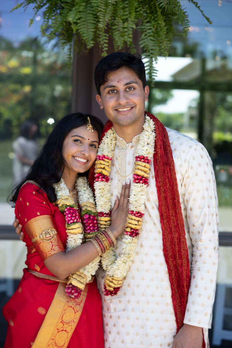 Sanchu and Ashwin wearing wedding garlands